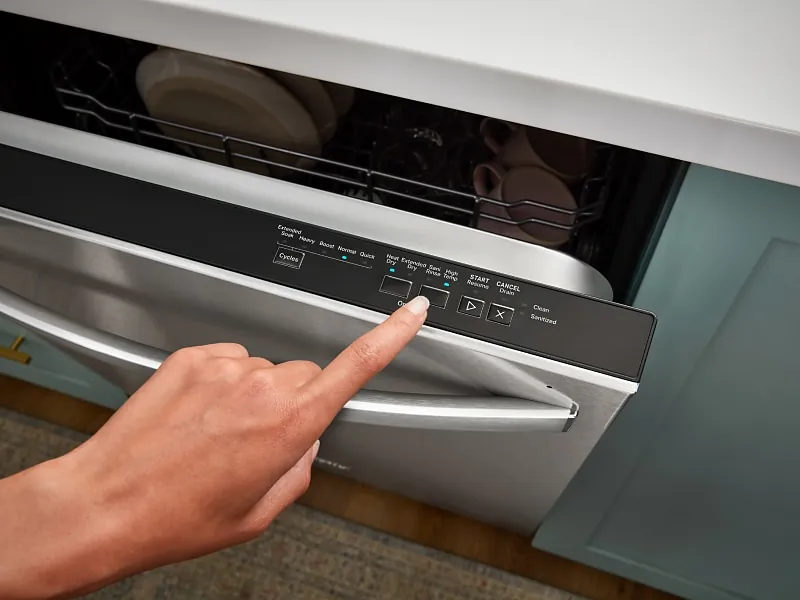 The digital timer on a dishwasher display tracks the remaining cycle run time.