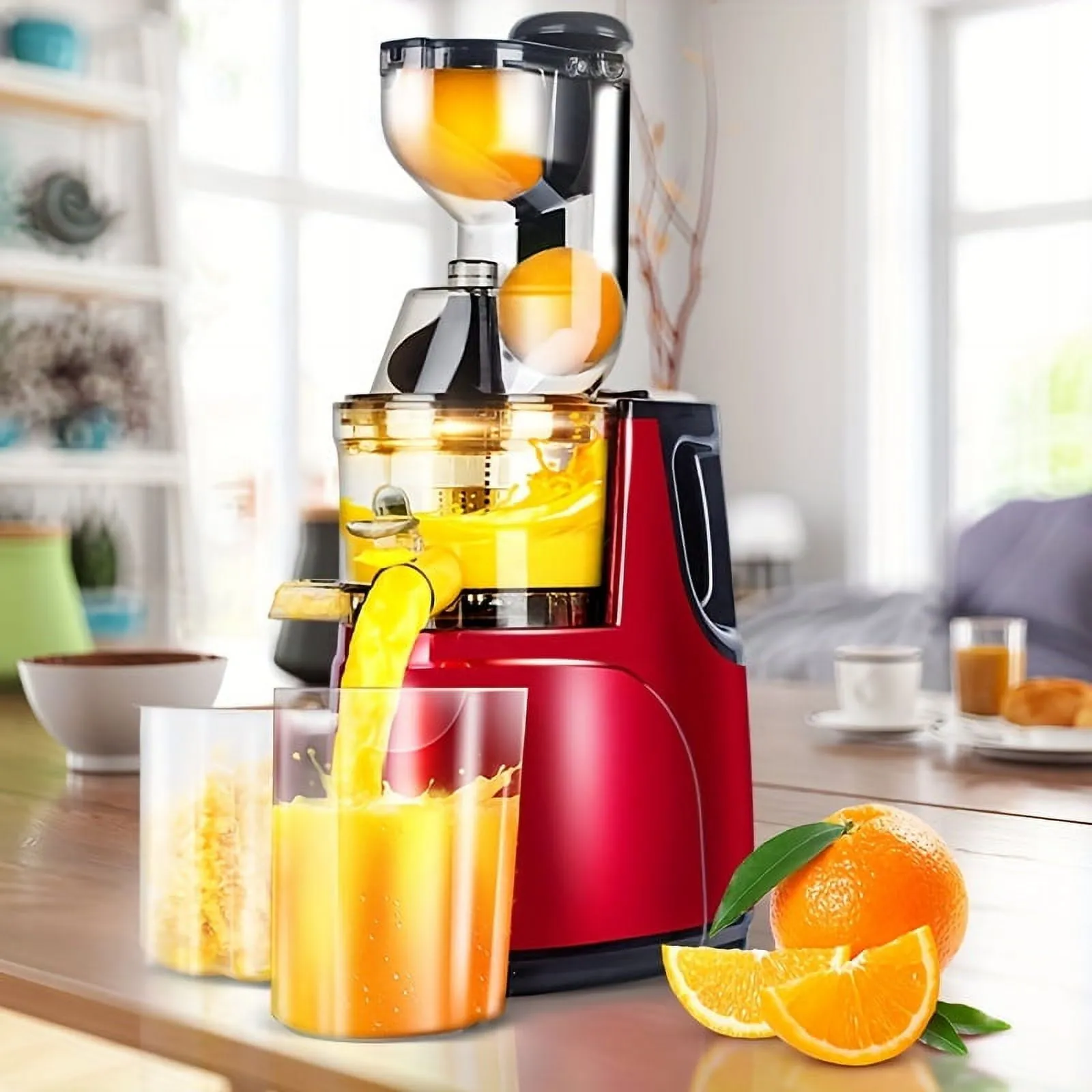 A halved peach with the pit removed beside a masticating juicer.