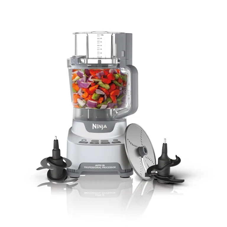 A person unplugging the food processor motor base for safe cleaning.